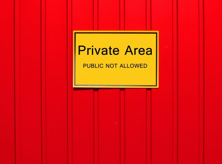 Private area sign on red background